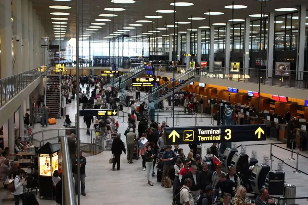 Kastrup Airport with people walking in lines